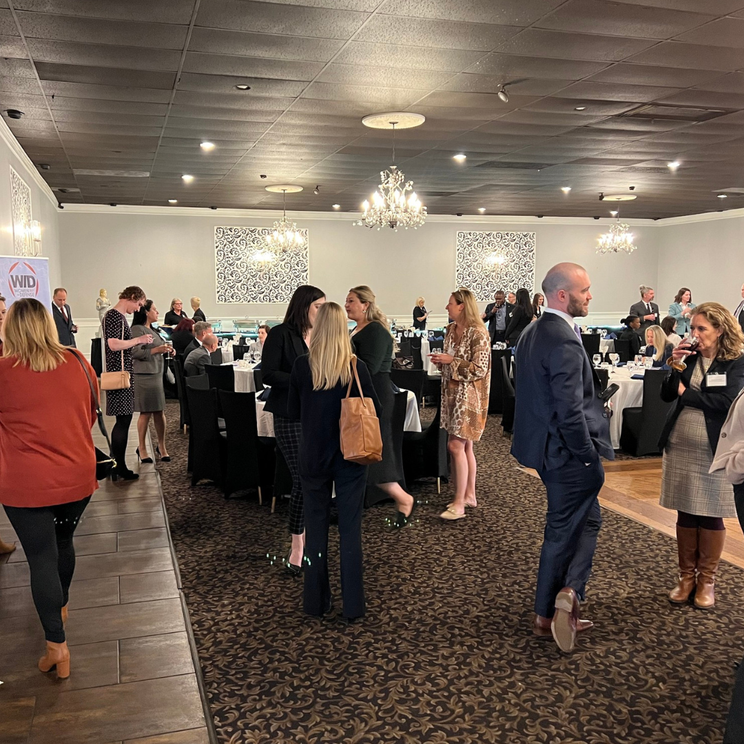 Several community members speak at a community networking event.