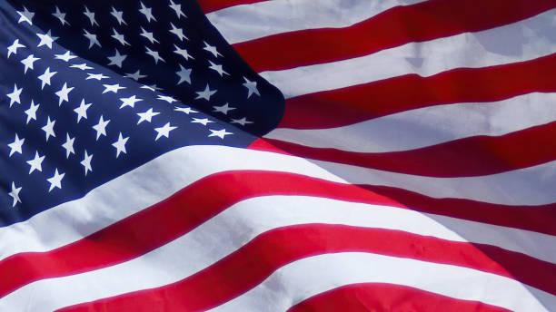 An American flag blows in the breeze